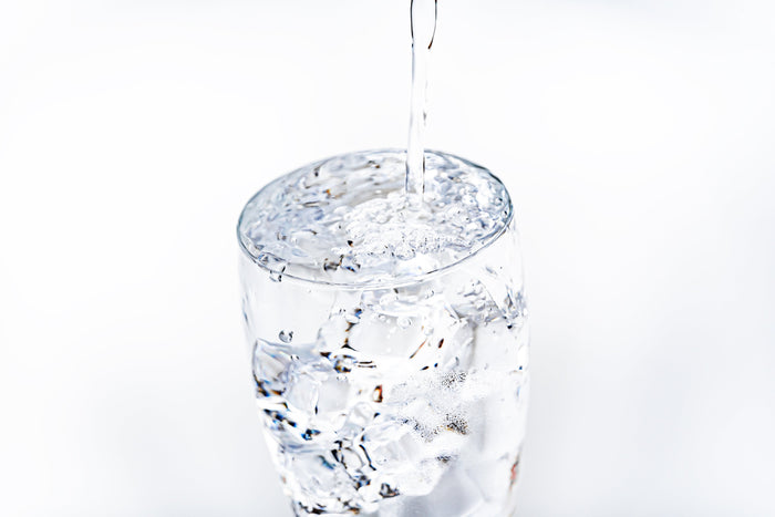 Why Hydration Matters More as You Age - And How to Keep Your Skin Moisturized. Glass of fresh water