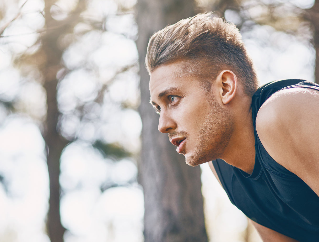 Handsome young man in his 20's exercising outdoors