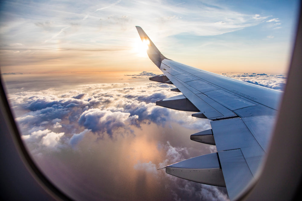 airplane wing sunset flying travel