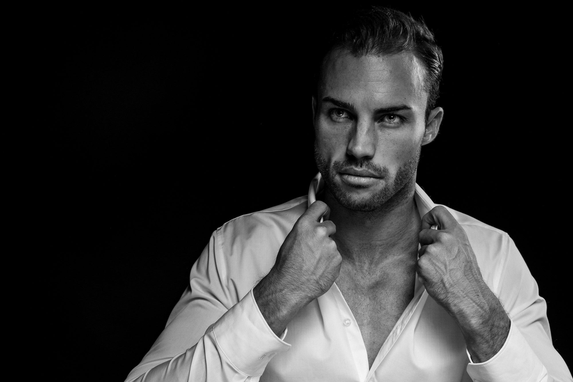 How to Build a Skincare Routine that Gets You Noticed. Close up of handsome man in black and white