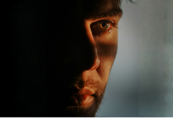 “Ozempic Face” Isn't Just Volume Loss. Your Collagen Is Taking A Hit Too. Close up of man's face looking gaunt.