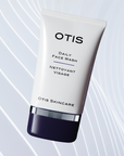 Tube of OTIS Daily Face Wash on white wavy textured background